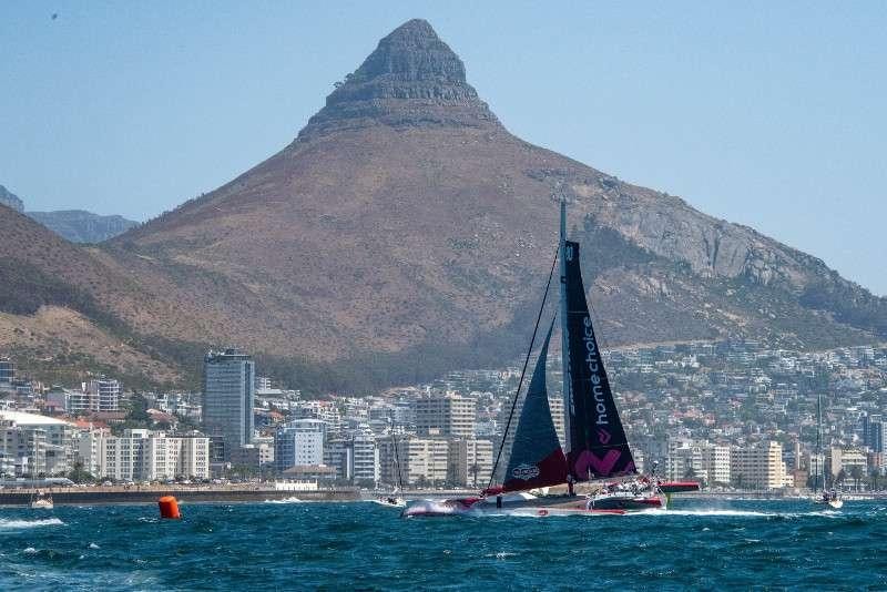 a sailboat in the water in front of a large mountain aboard ULTIM EMOTION 2 Yacht for Charter