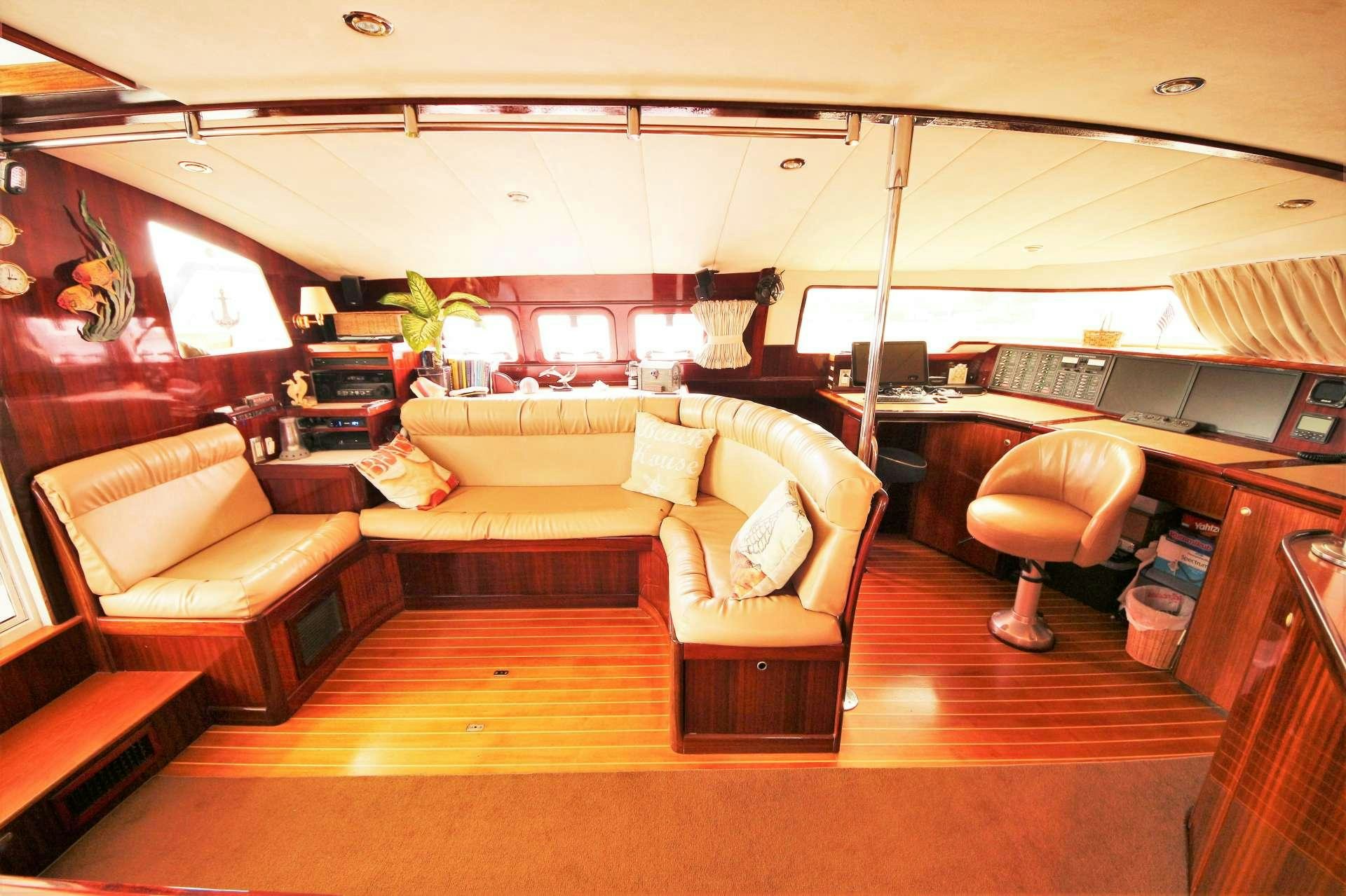 a living room with a couch and a table aboard SOUTHERN PASSAGE Yacht for Charter