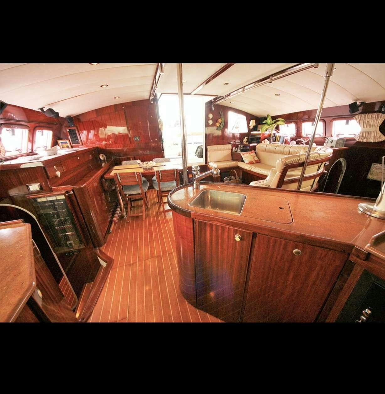 a bar with a table and chairs aboard SOUTHERN PASSAGE Yacht for Charter