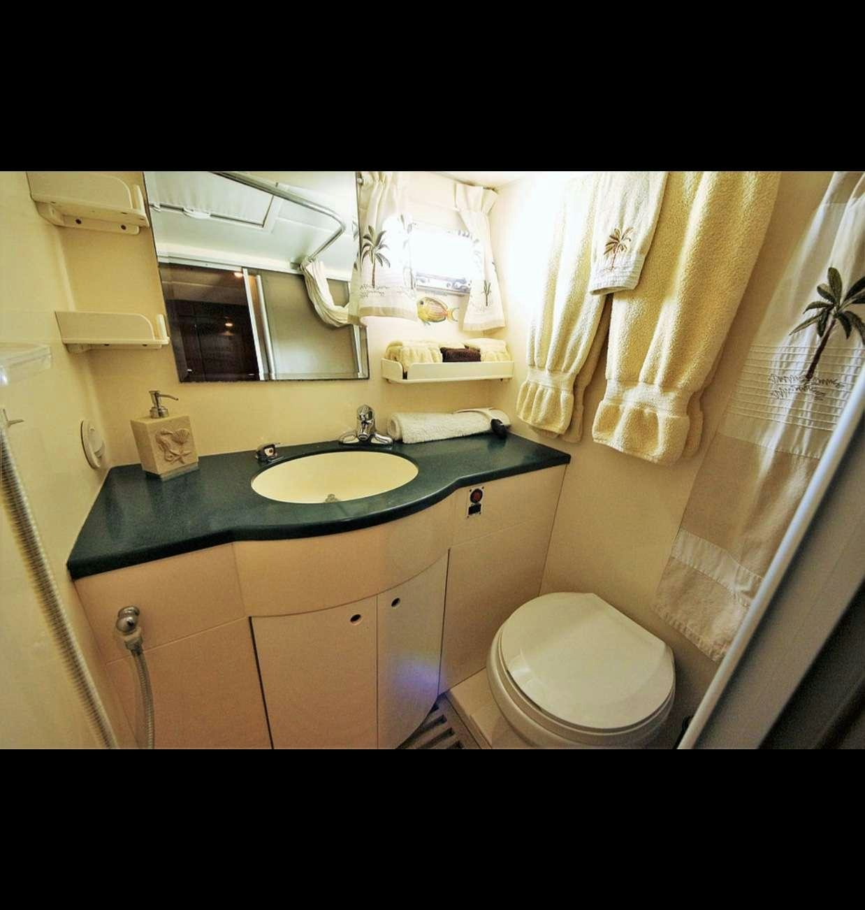 a bathroom with a sink and toilet aboard SOUTHERN PASSAGE Yacht for Charter