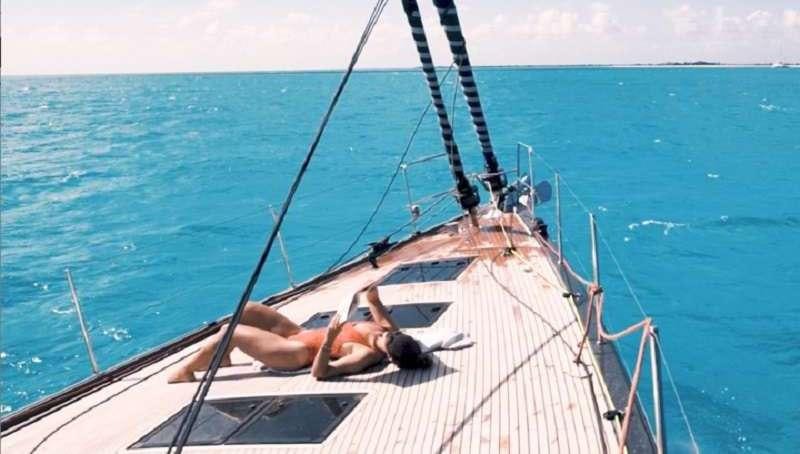 a person lying on a boat in the water aboard BODHISATTVA (Caribbean) Yacht for Charter