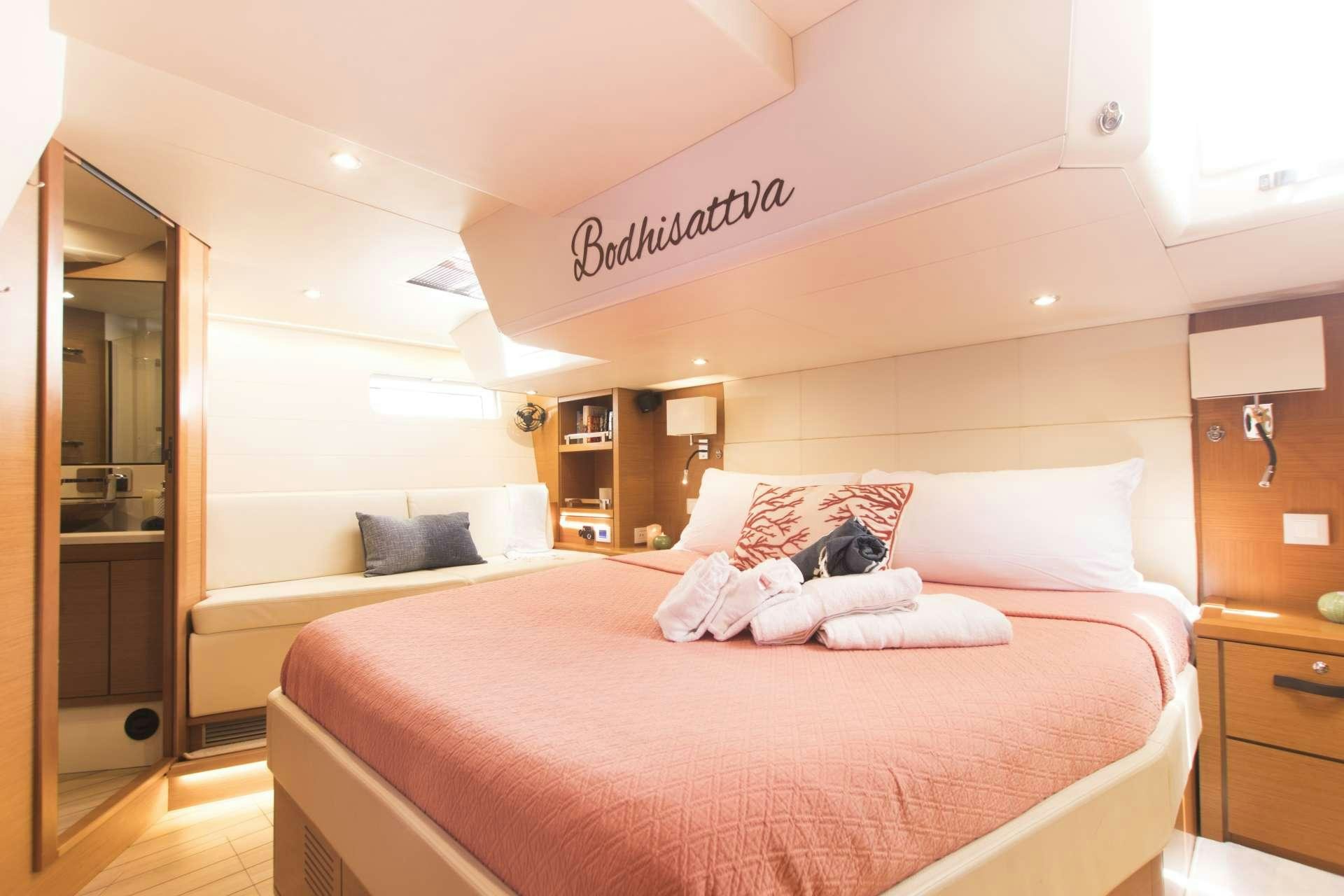 a hotel room with a bed aboard BODHISATTVA (Caribbean) Yacht for Charter
