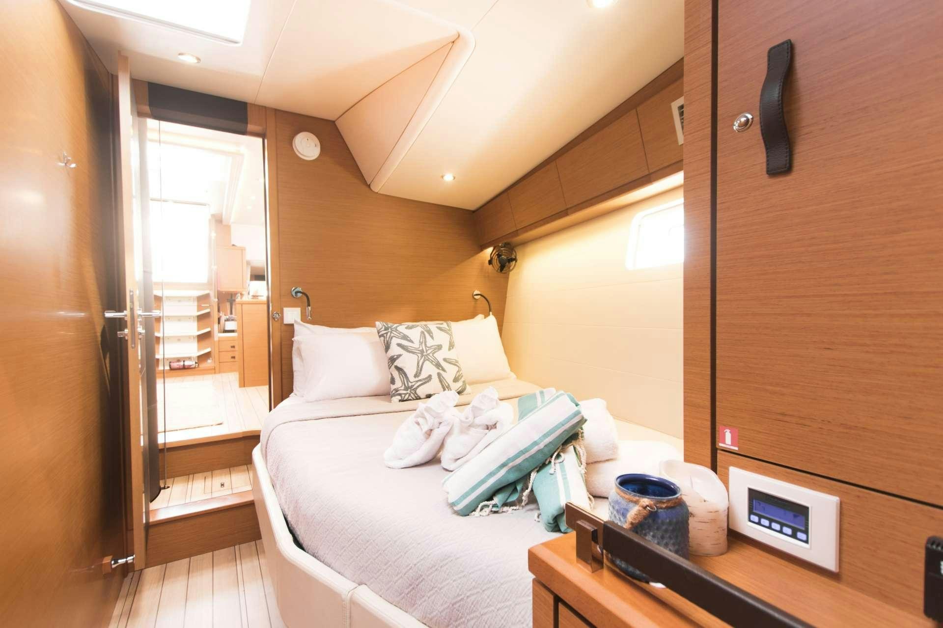 a bed in a room aboard BODHISATTVA (Caribbean) Yacht for Charter