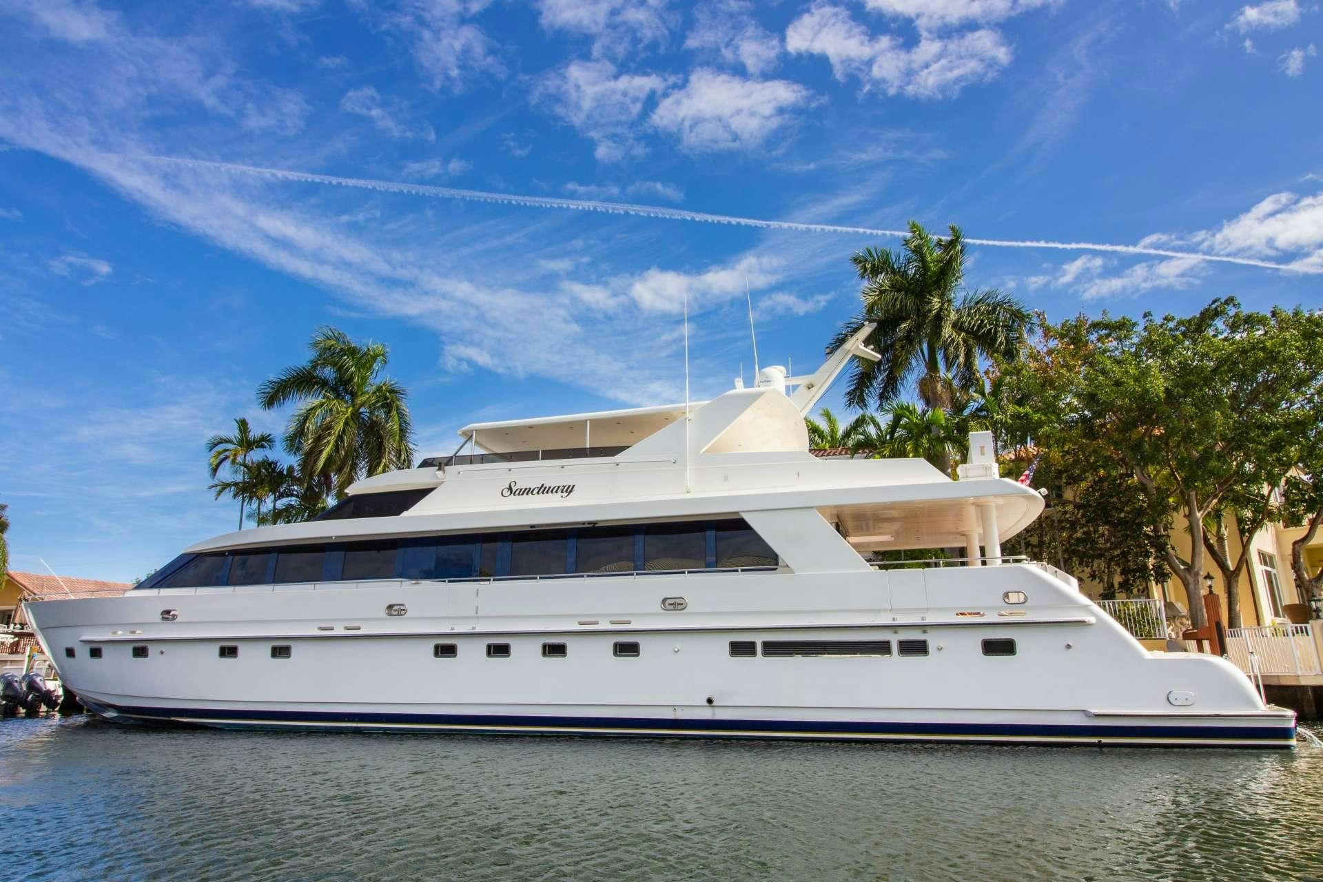 a large white boat in the water aboard SANCTUARY Yacht for Charter