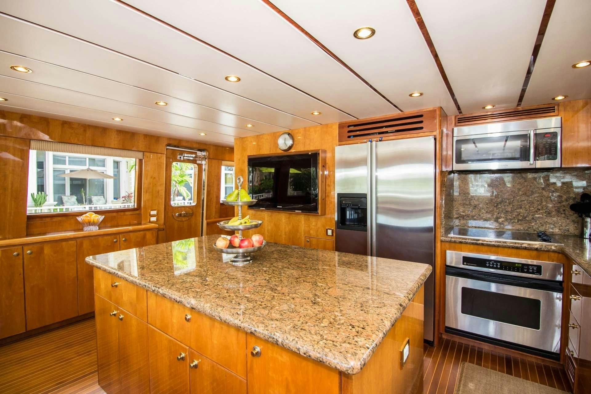 a kitchen with a large island aboard SANCTUARY Yacht for Charter