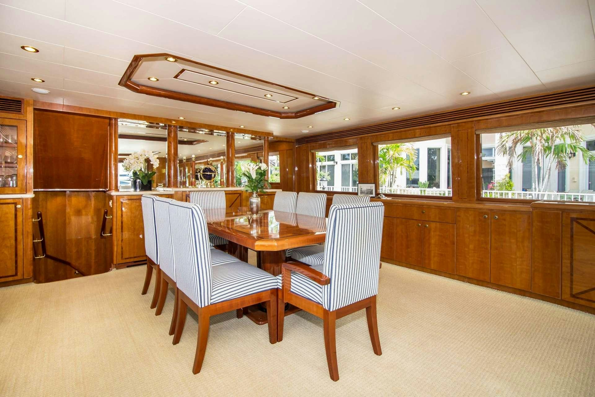 a room with a table and chairs aboard SANCTUARY Yacht for Charter