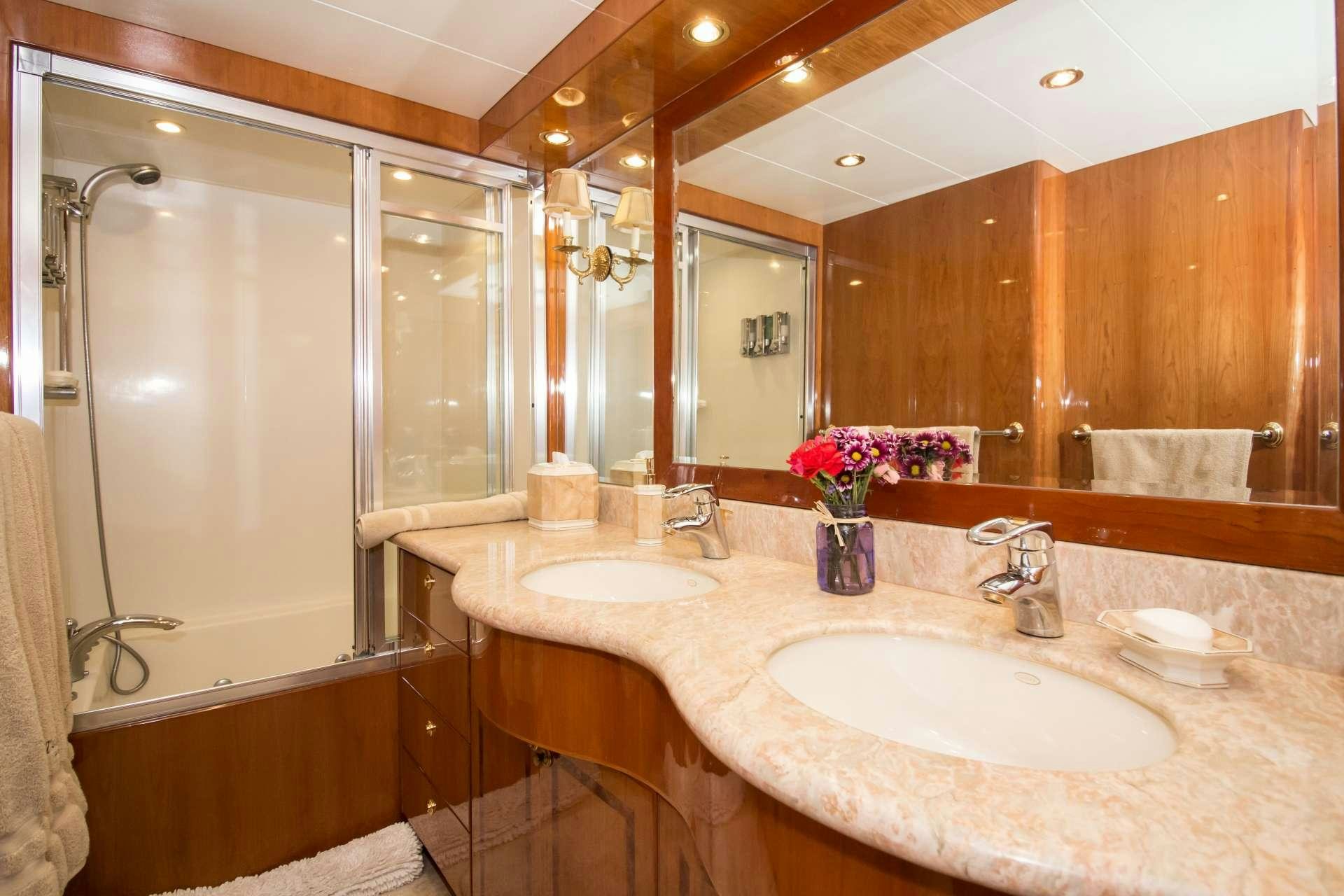 a bathroom with a large mirror aboard SANCTUARY Yacht for Charter