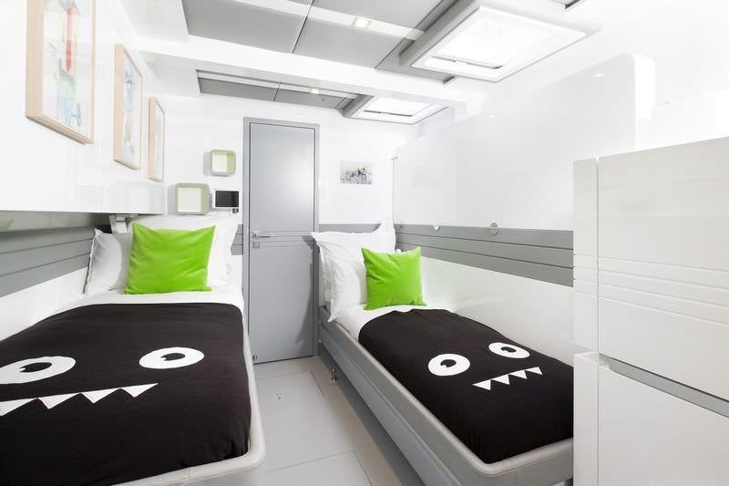 a room with a bed and a desk aboard MAVERICK Yacht for Charter