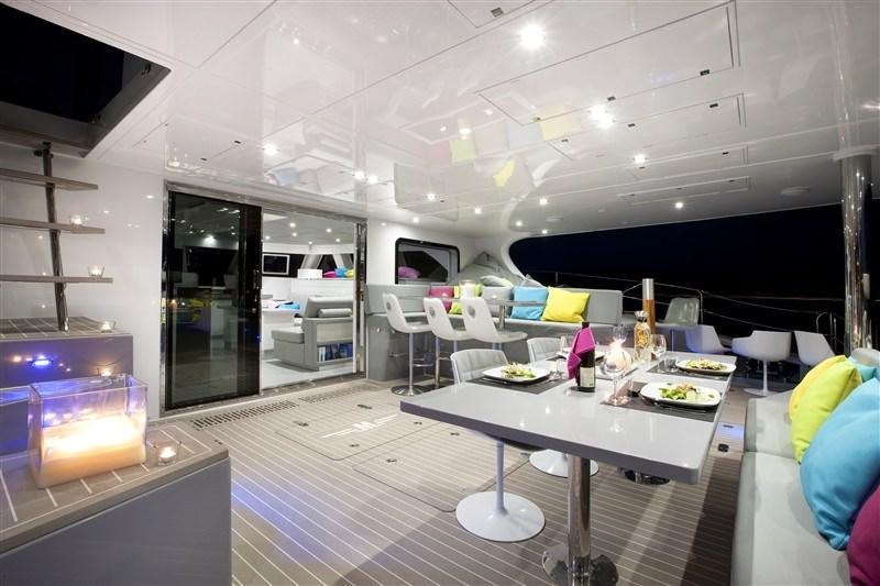 a room with a table and chairs aboard MAVERICK Yacht for Charter