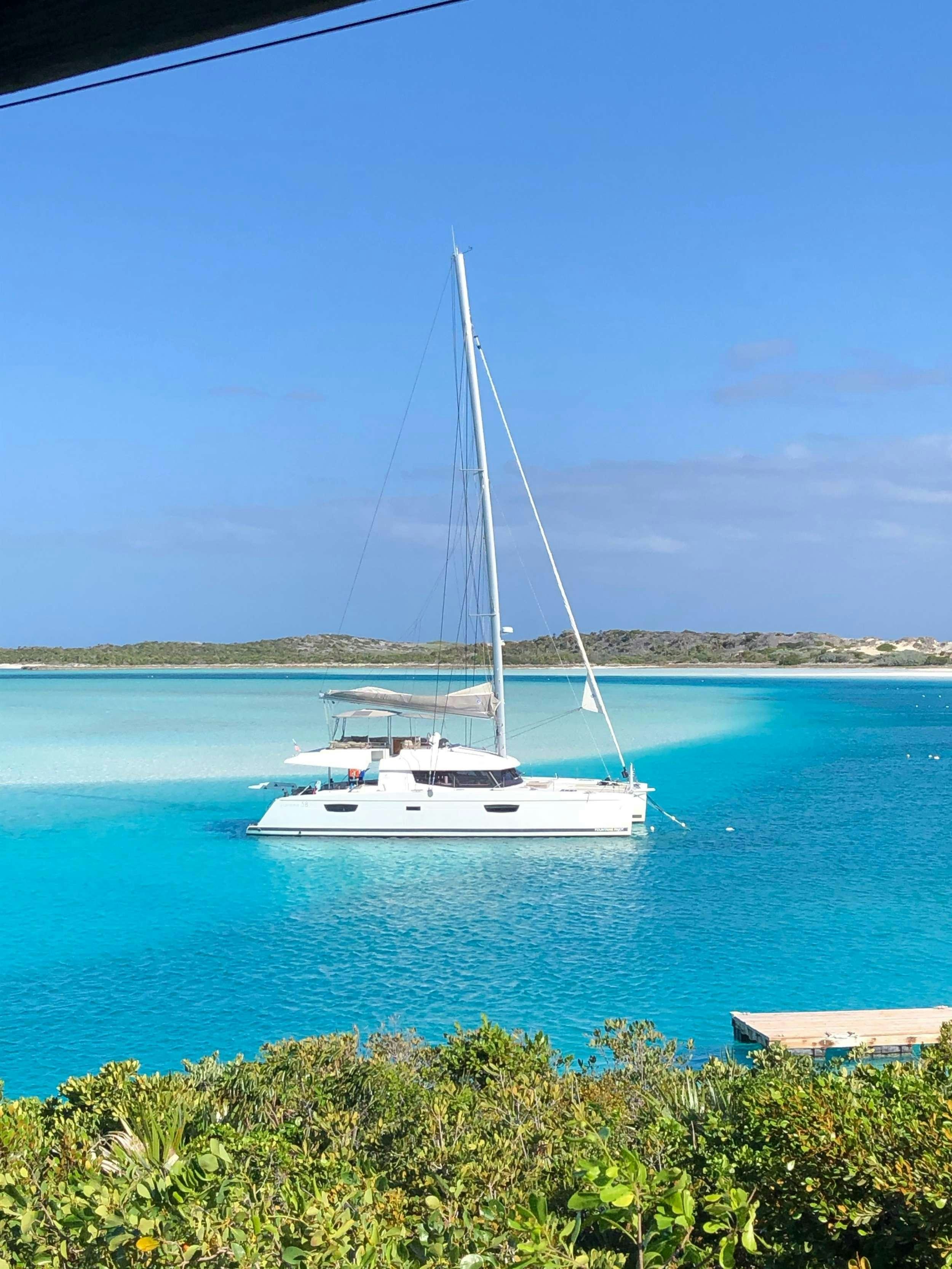 a white boat in the water aboard ENCHANTE Yacht for Charter