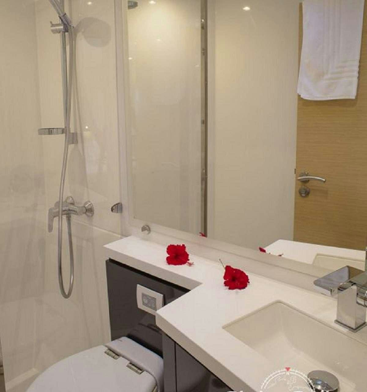 a bathroom with a sink and a toilet aboard ENCHANTE Yacht for Charter