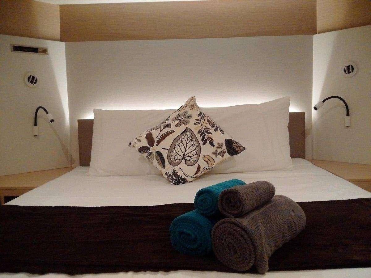 a bed with pillows aboard ENCHANTE Yacht for Charter