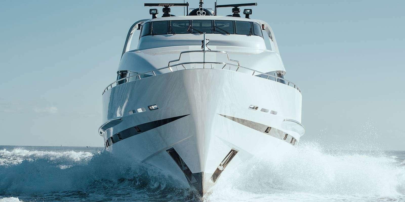 a white yacht on the water aboard ENTOURAGE Yacht for Charter