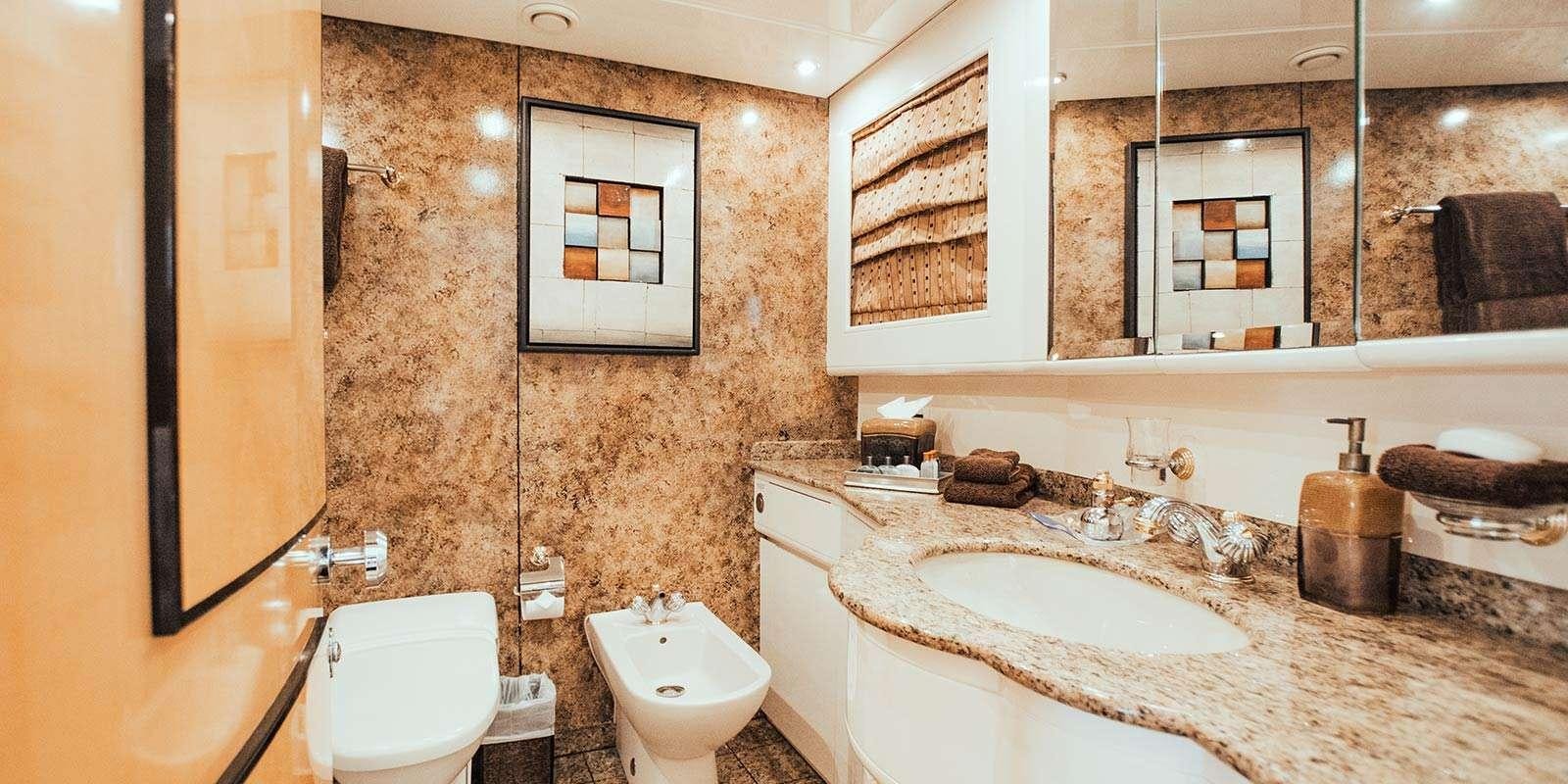 a bathroom with a sink and a toilet aboard ENTOURAGE Yacht for Charter
