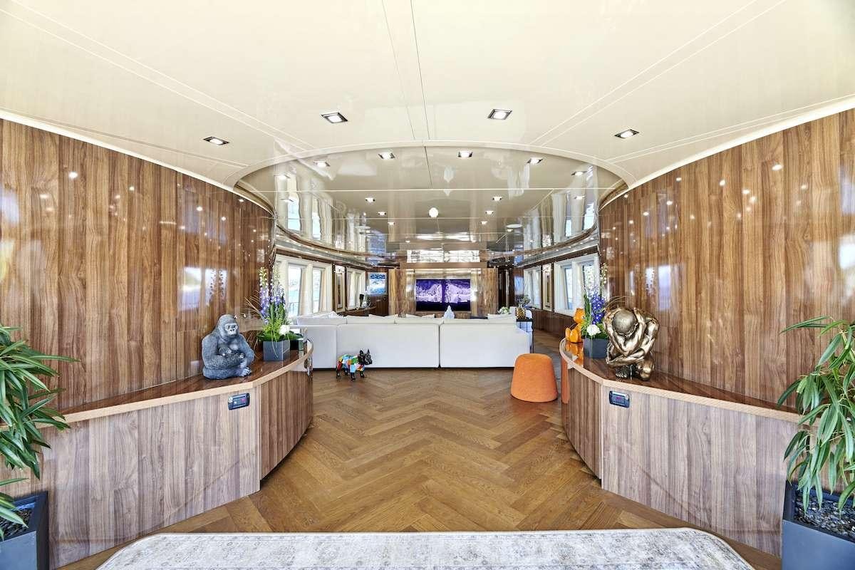 a room with a wood floor and a wood wall aboard DALOLI Yacht for Charter