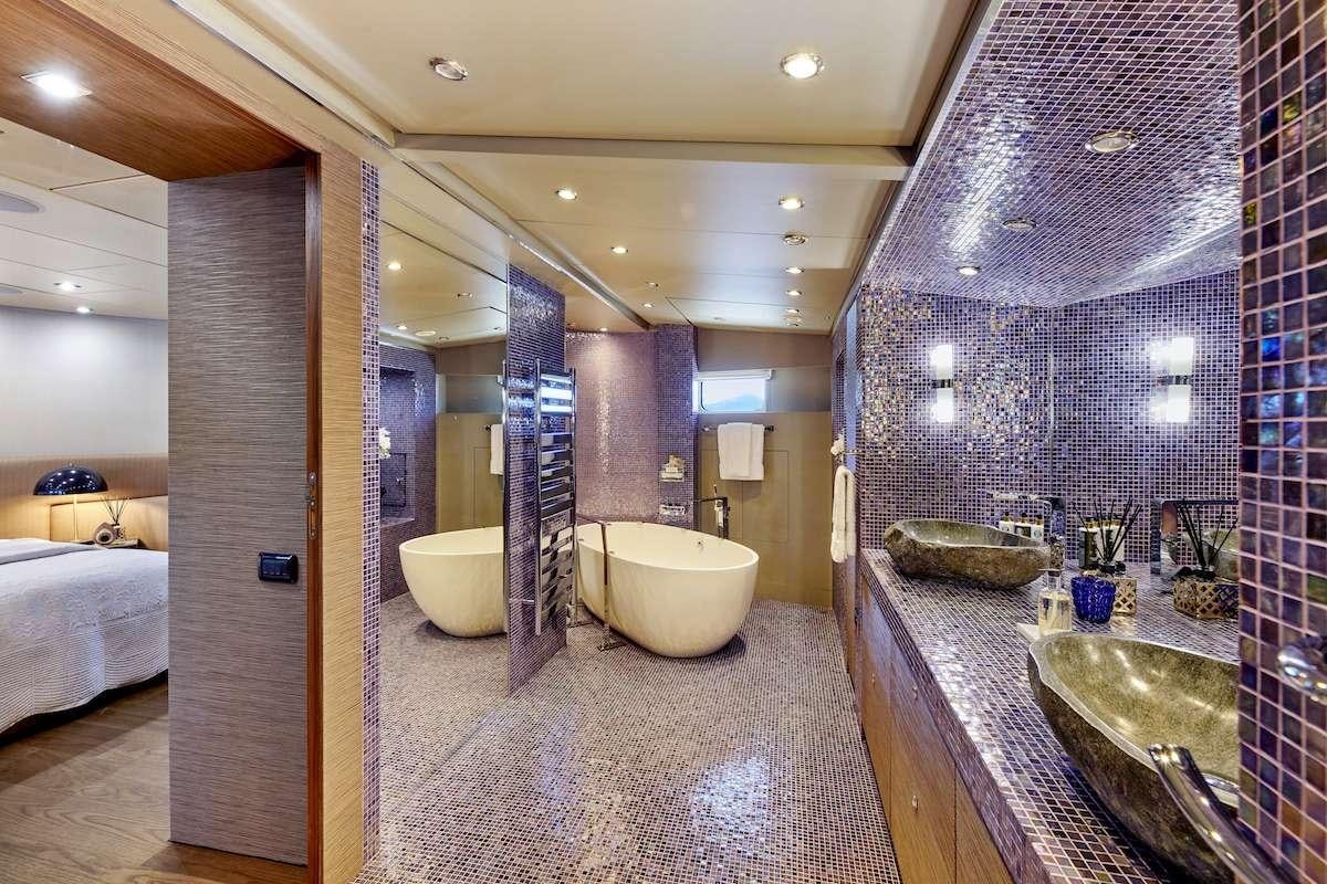 a bathroom with a sink and a bathtub aboard DALOLI Yacht for Charter