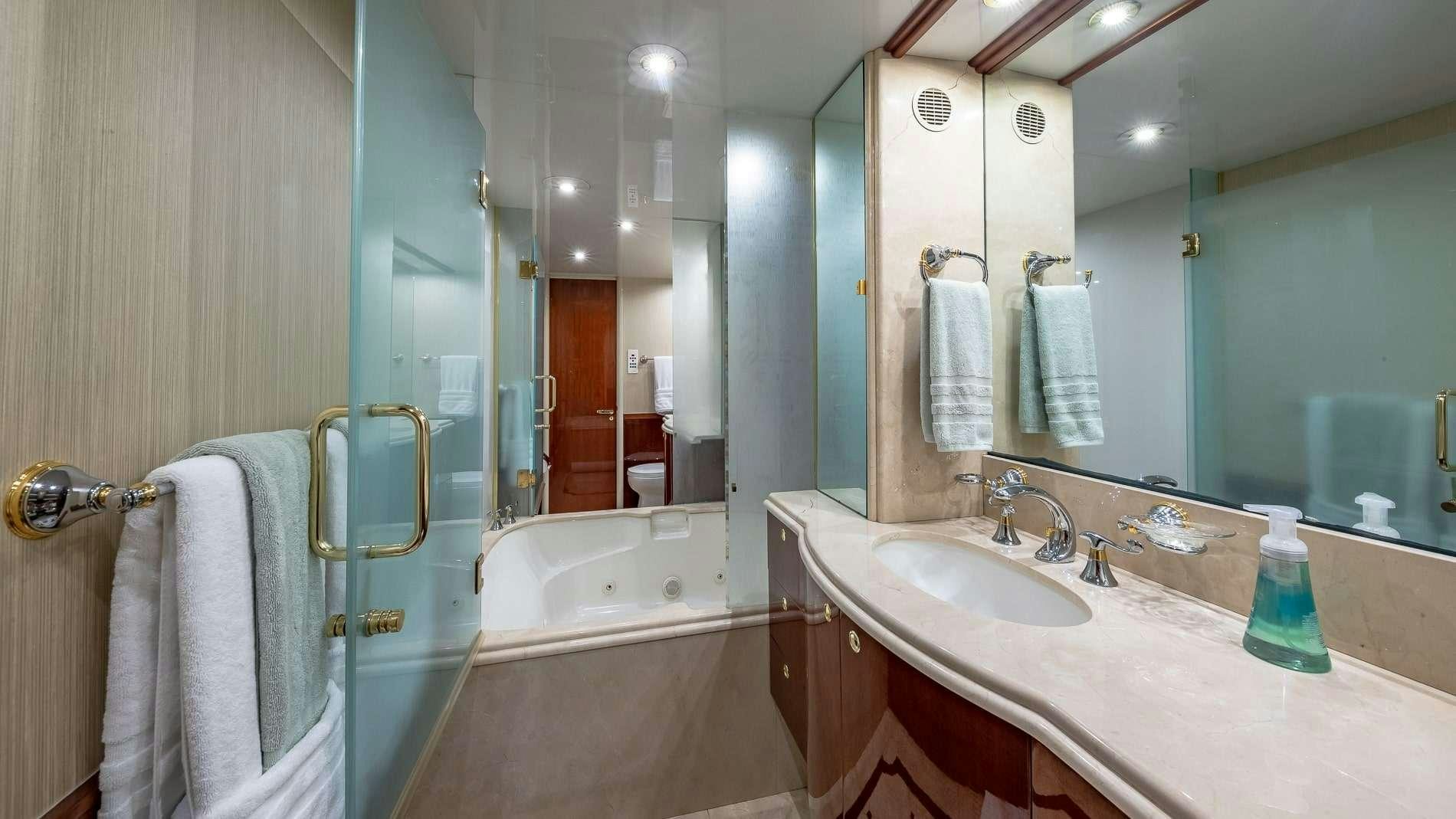 a bathroom with a large mirror aboard IV TRANQUILITY Yacht for Charter