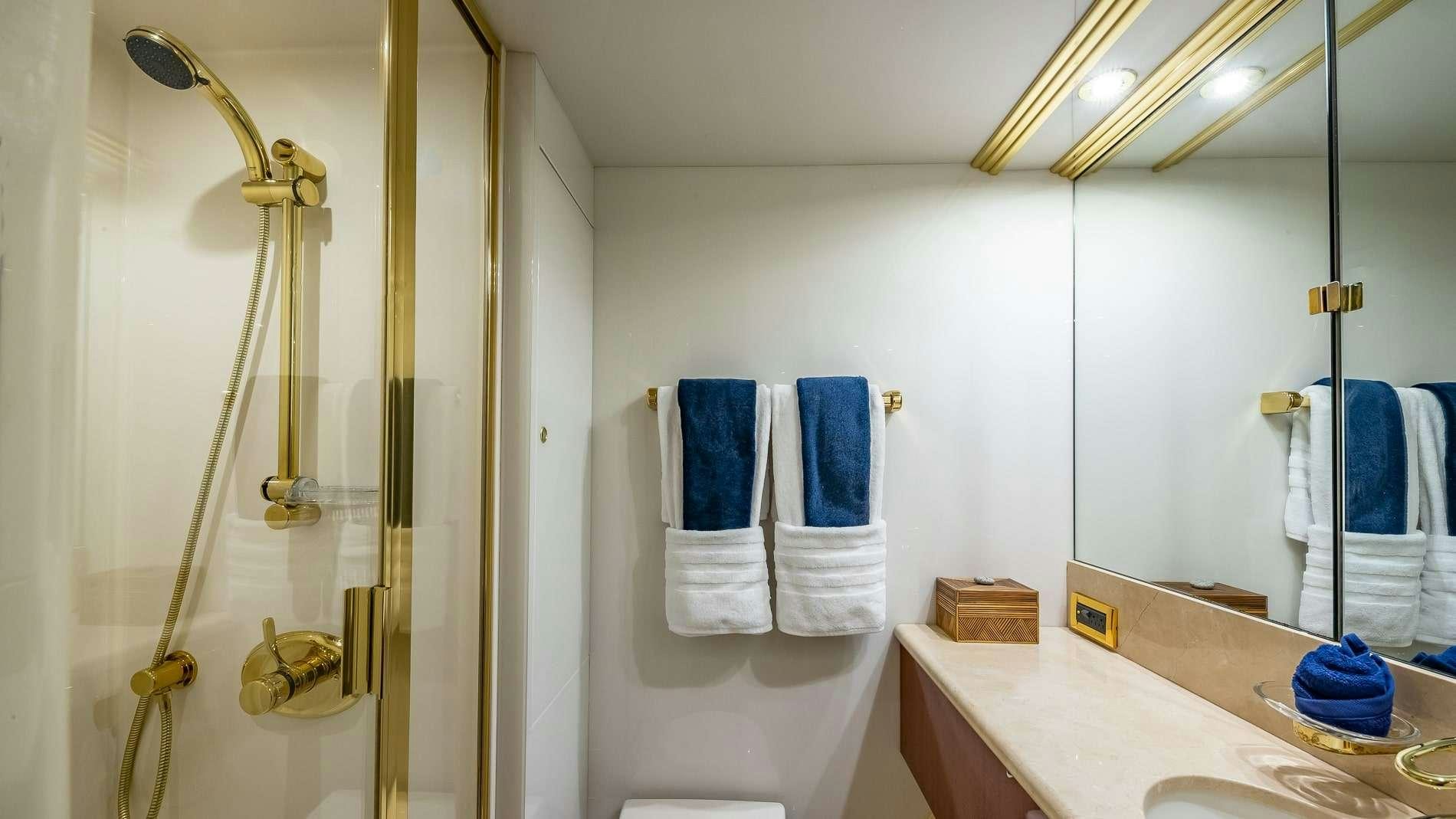 a bathroom with a shower and sink aboard IV TRANQUILITY Yacht for Charter