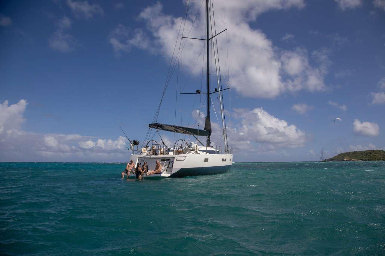 a boat sailing in the sea aboard CNB66 Yacht for Charter
