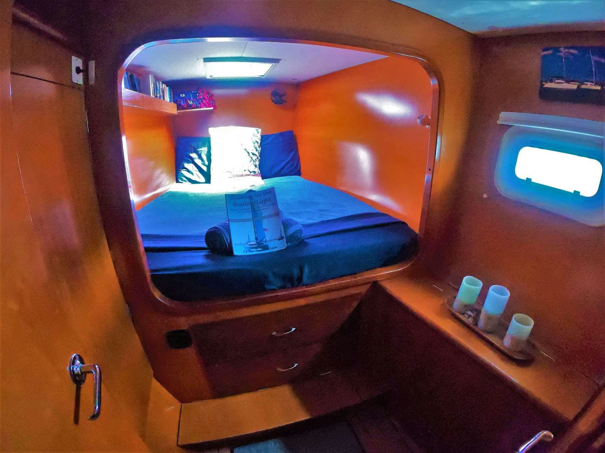 a bed in a room aboard GUIDING LIGHT Yacht for Charter