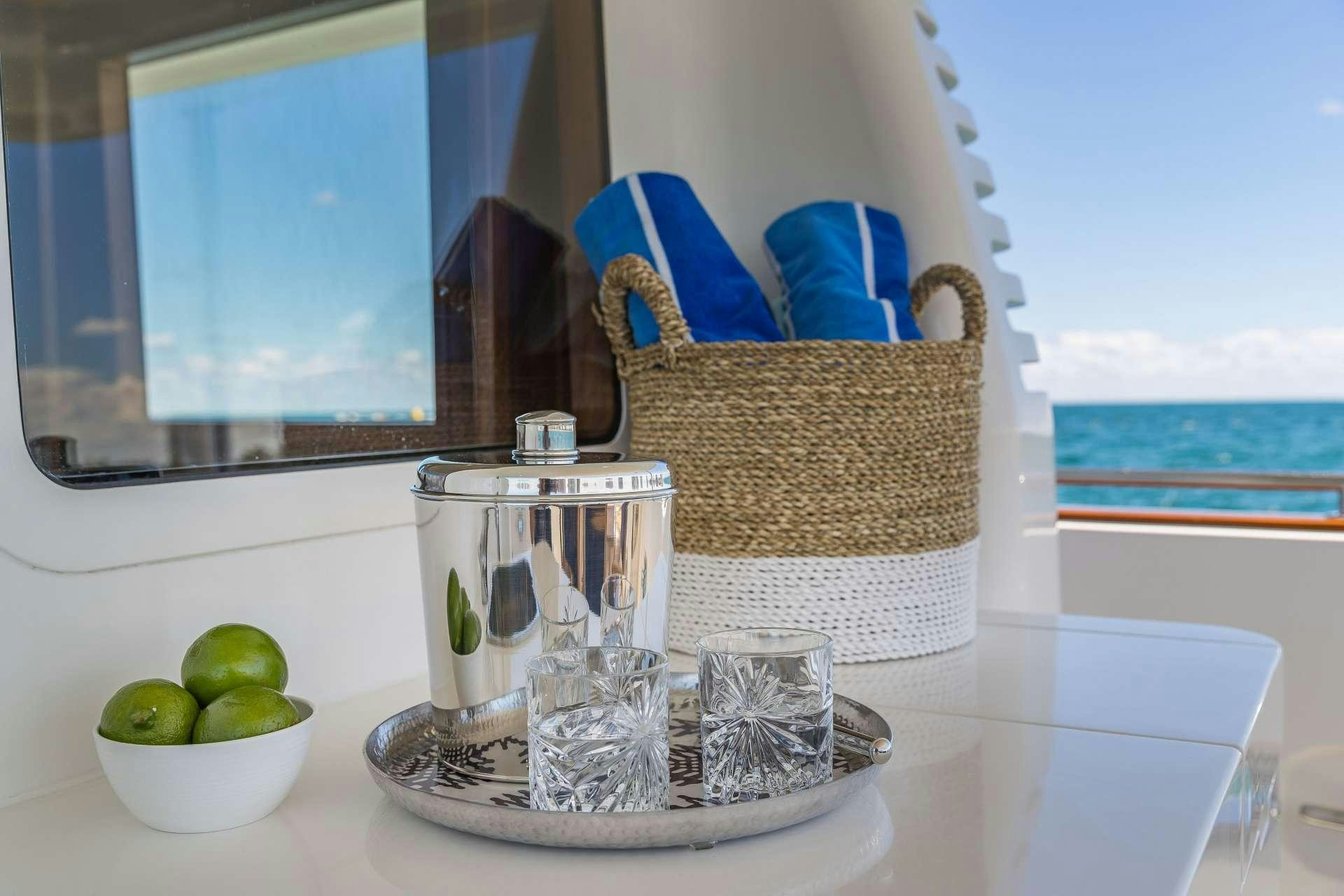 a table with a glass and a basket with food on it aboard ASTURIAS Yacht for Charter