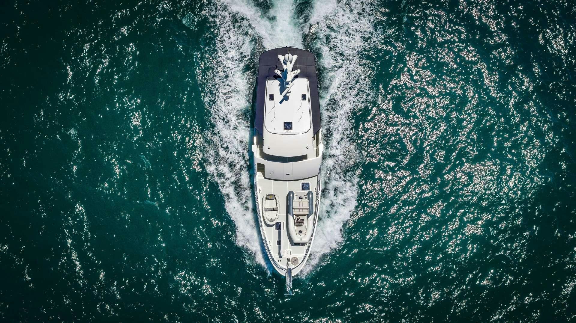 a white car on a blue surface aboard ASTURIAS Yacht for Charter