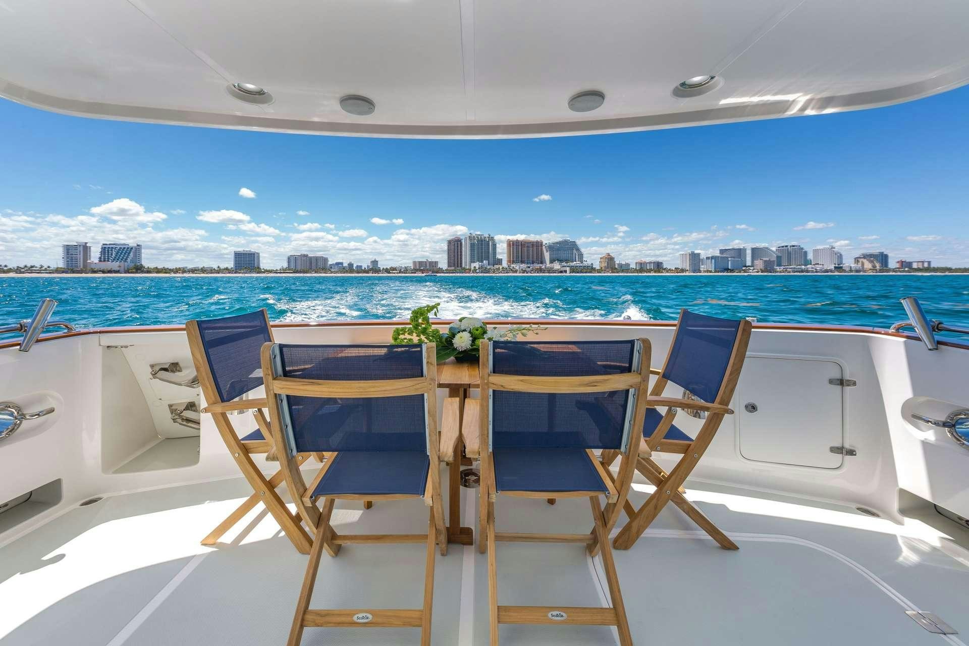 a table with chairs on it aboard ASTURIAS Yacht for Charter