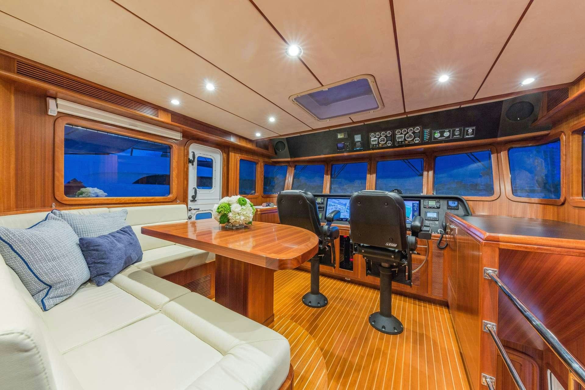 a room with a table and chairs aboard ASTURIAS Yacht for Charter