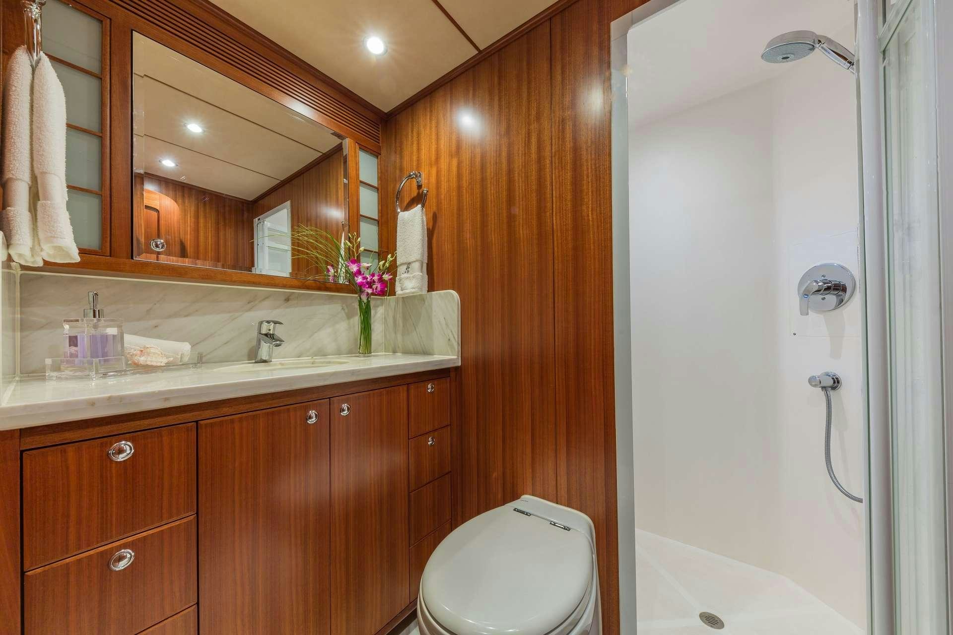 a bathroom with a shower and sink aboard ASTURIAS Yacht for Charter