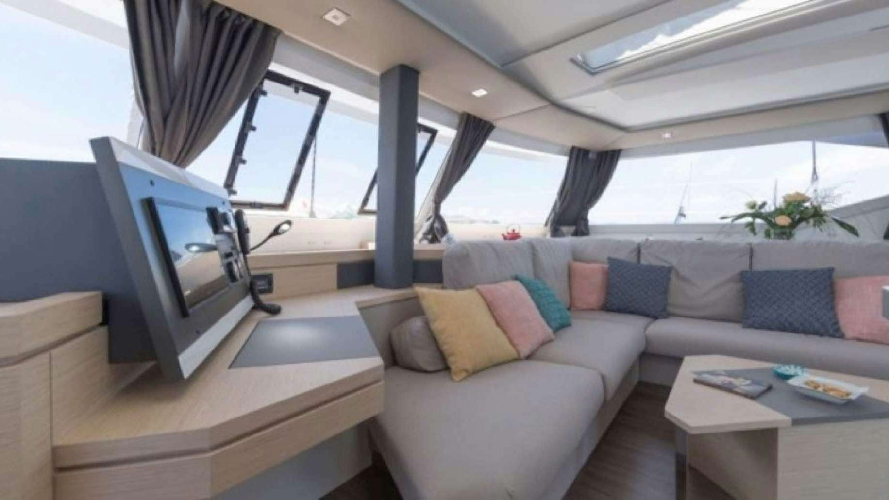 a living room with a couch and a computer aboard Luna Bliss Yacht for Charter