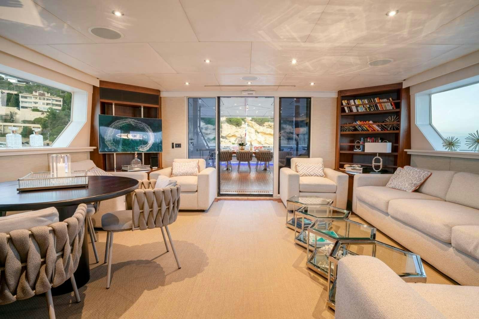 a living room with a large window aboard ENVY Yacht for Charter