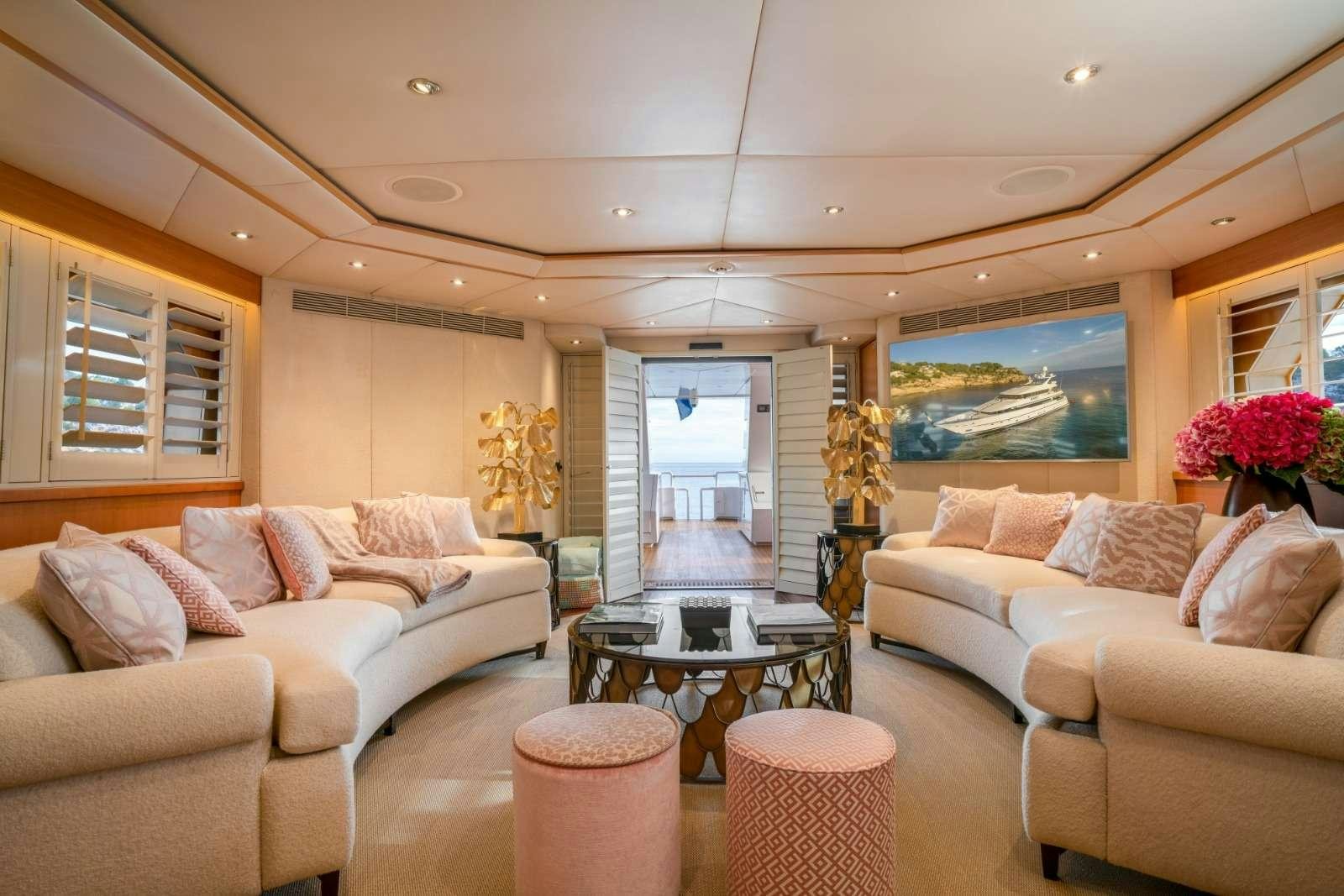 a living room with a large window aboard ENVY Yacht for Charter