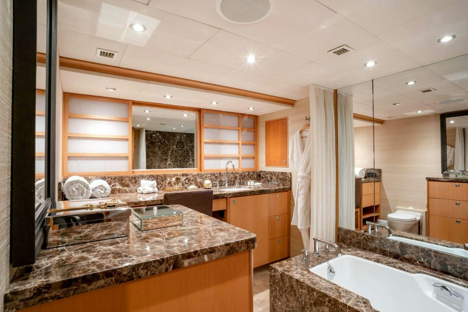 a bathroom with a marble counter top aboard ENVY Yacht for Charter