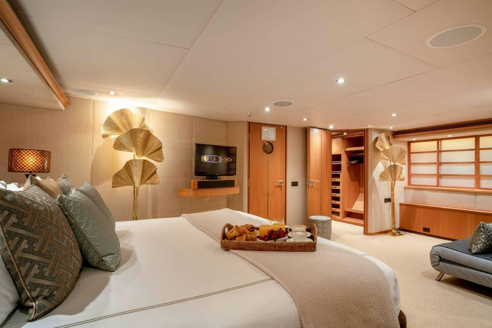 a large bedroom with a large bed aboard ENVY Yacht for Charter