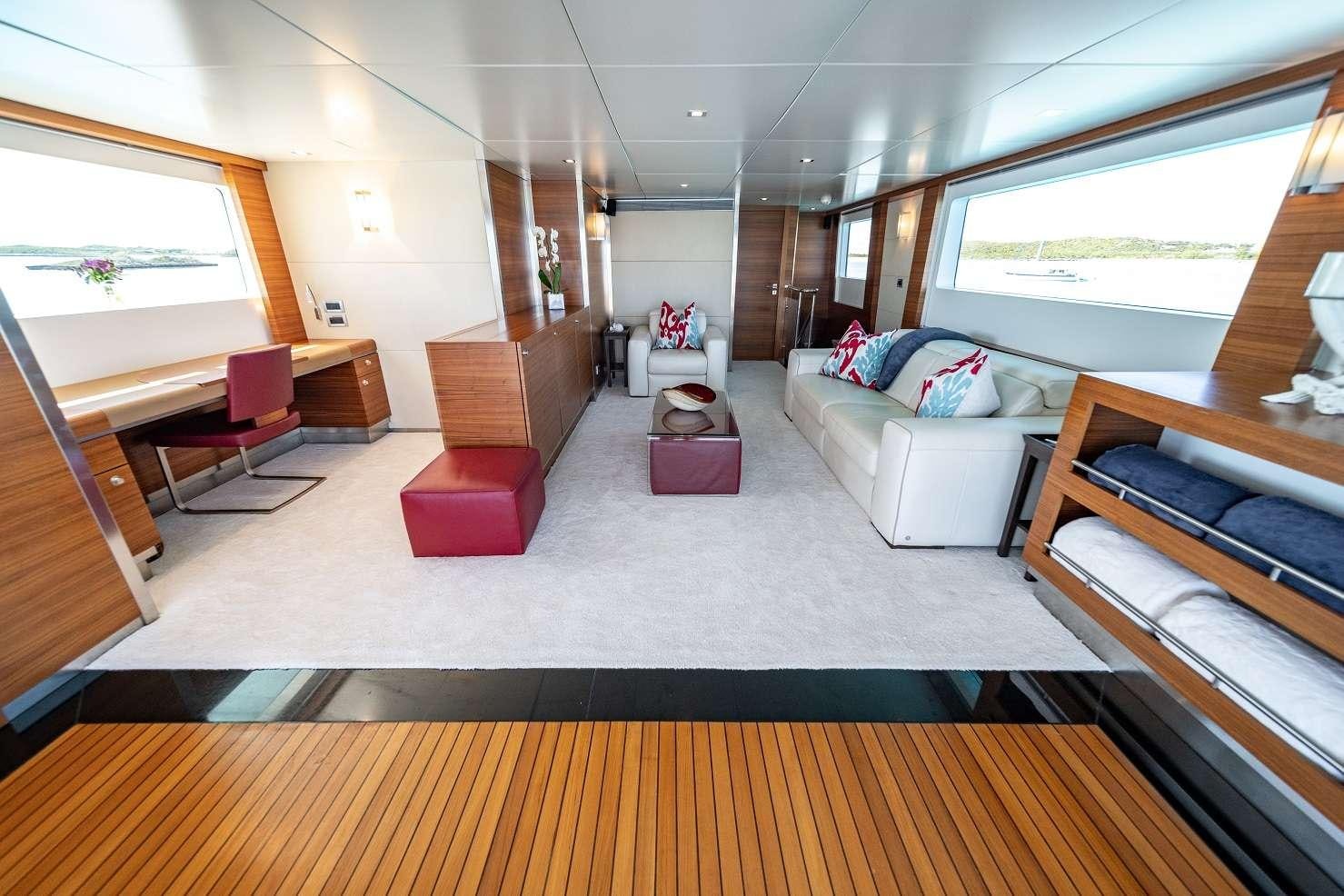 a room with a bed and a couch aboard SEA AXIS Yacht for Charter