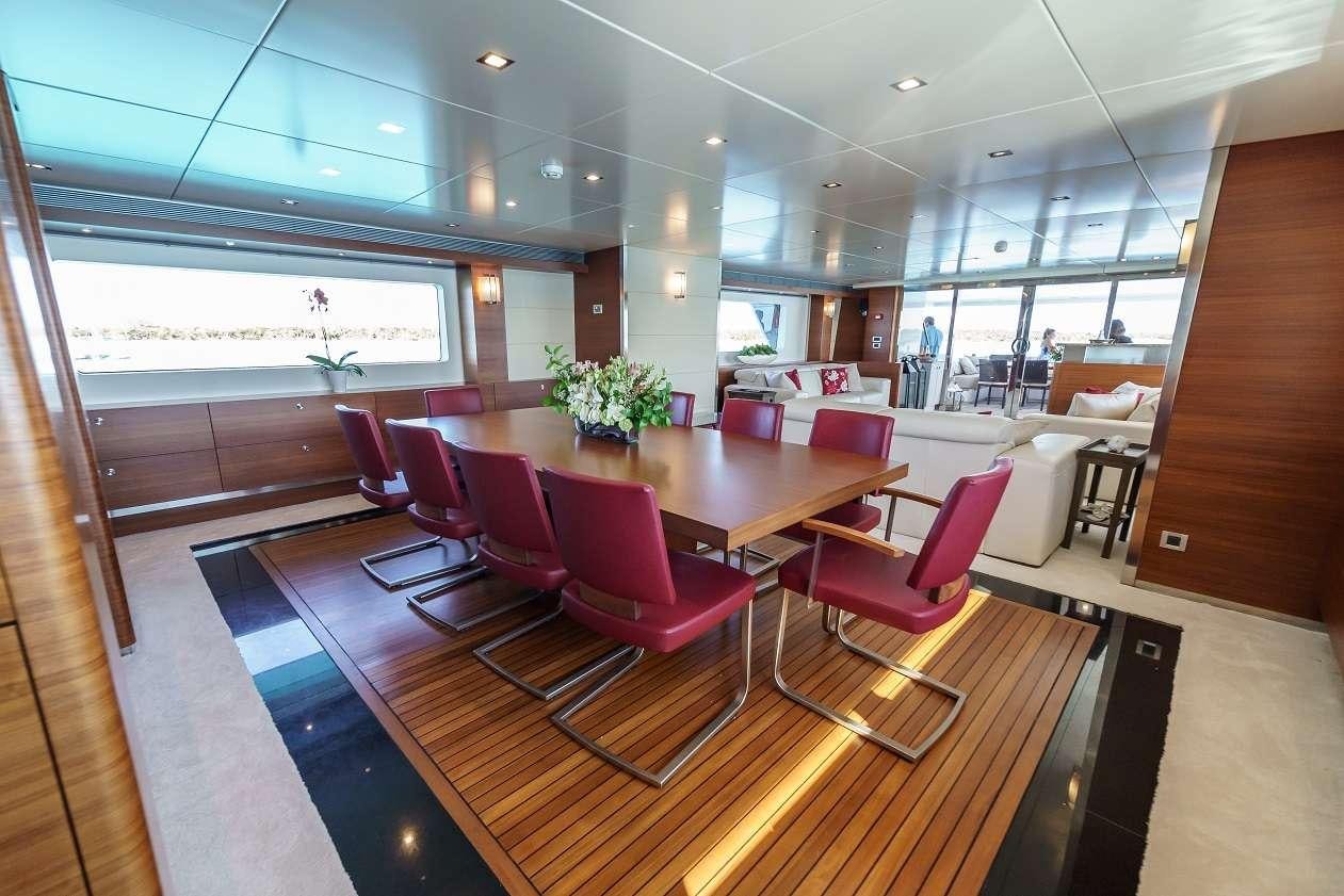 a room with a table and chairs aboard SEA AXIS Yacht for Charter