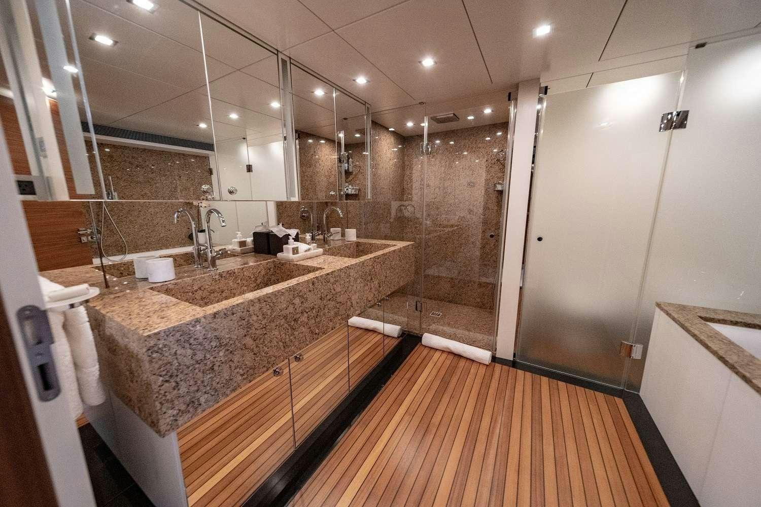 a bathroom with a large marble counter aboard SEA AXIS Yacht for Charter