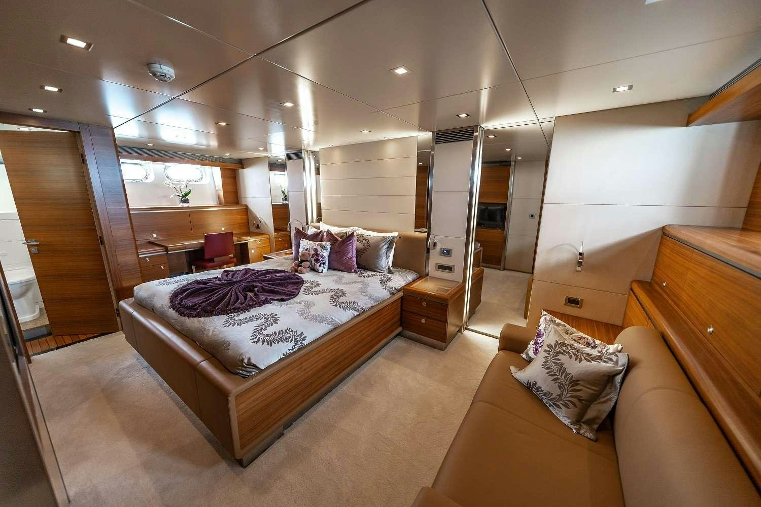 a large bedroom with a large bed aboard SEA AXIS Yacht for Charter