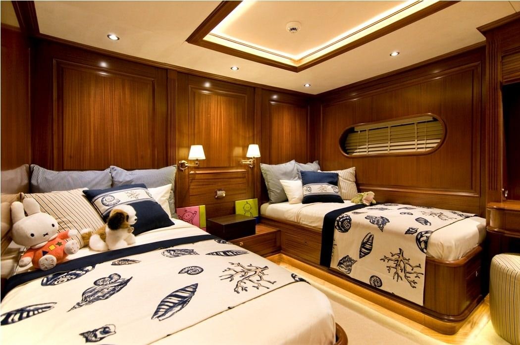 a bedroom with a bed and a couple of stuffed animals aboard CLEAR EYES Yacht for Charter