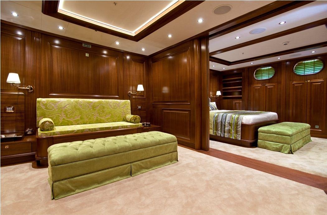a living room with a couch and a wood wall aboard CLEAR EYES Yacht for Charter