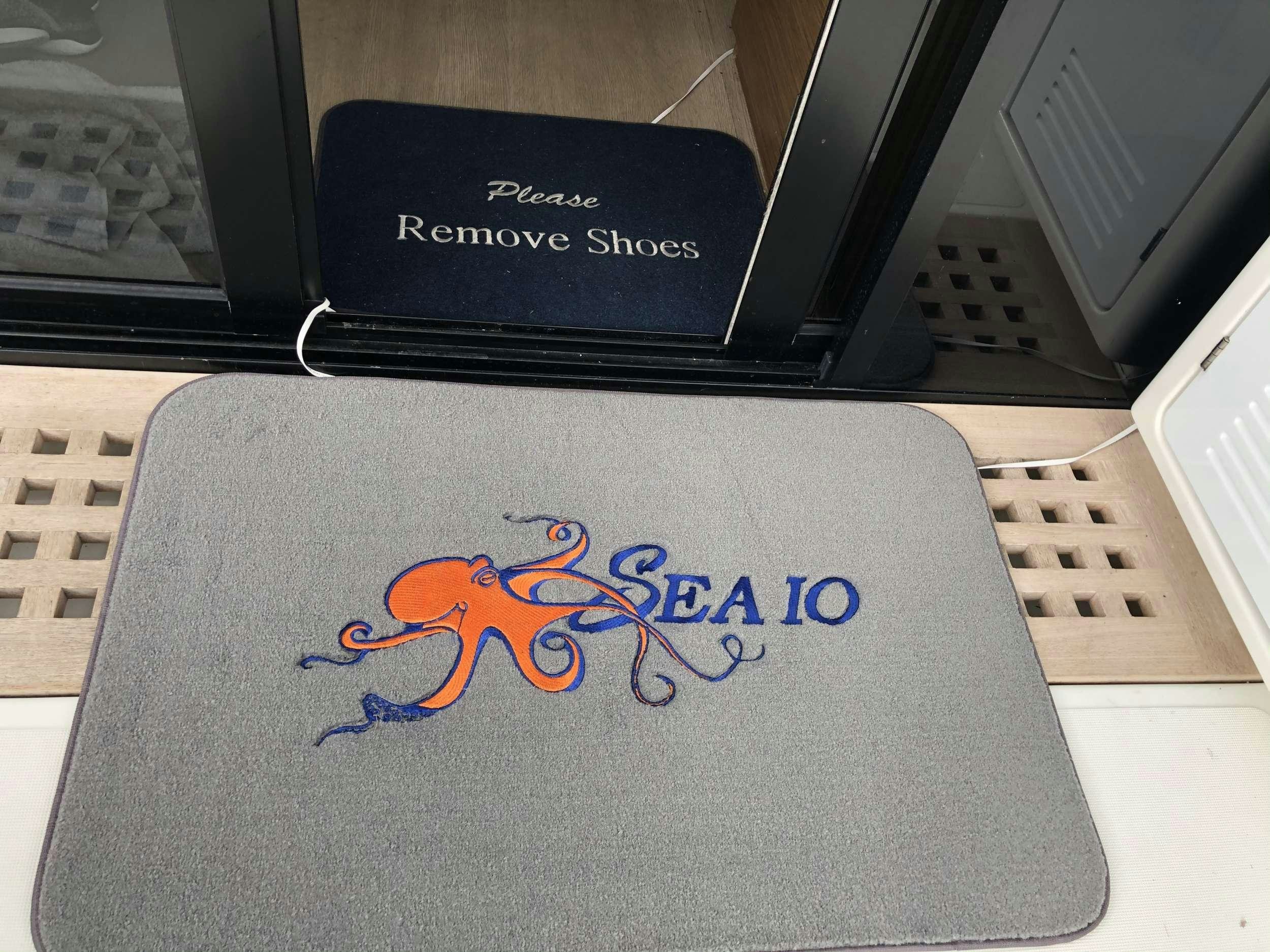 a white pillow with a cartoon bird on it aboard SEA IO Yacht for Charter