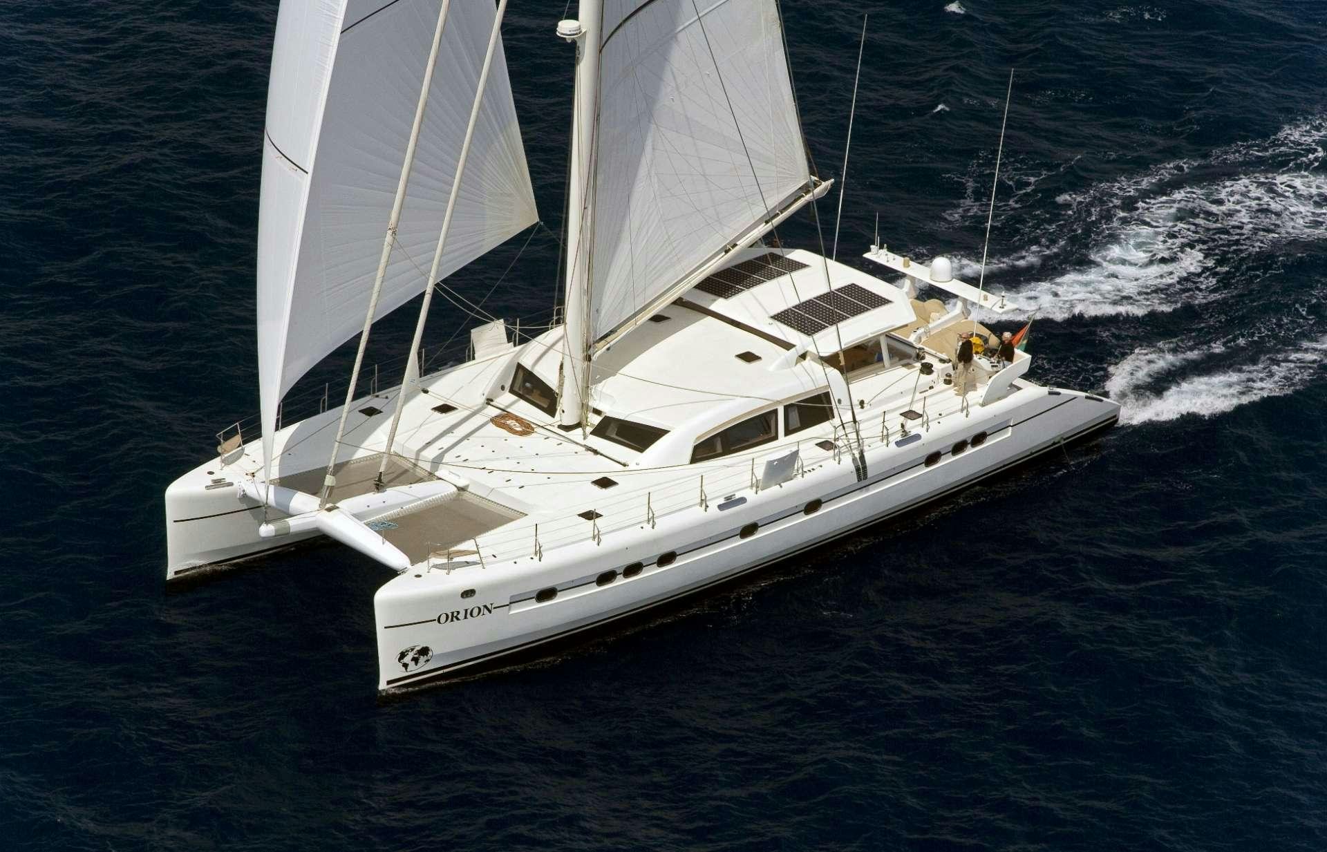 a white boat on the water aboard ORION 90 Yacht for Charter