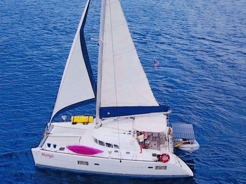 a white boat in the water aboard MANGO Yacht for Charter