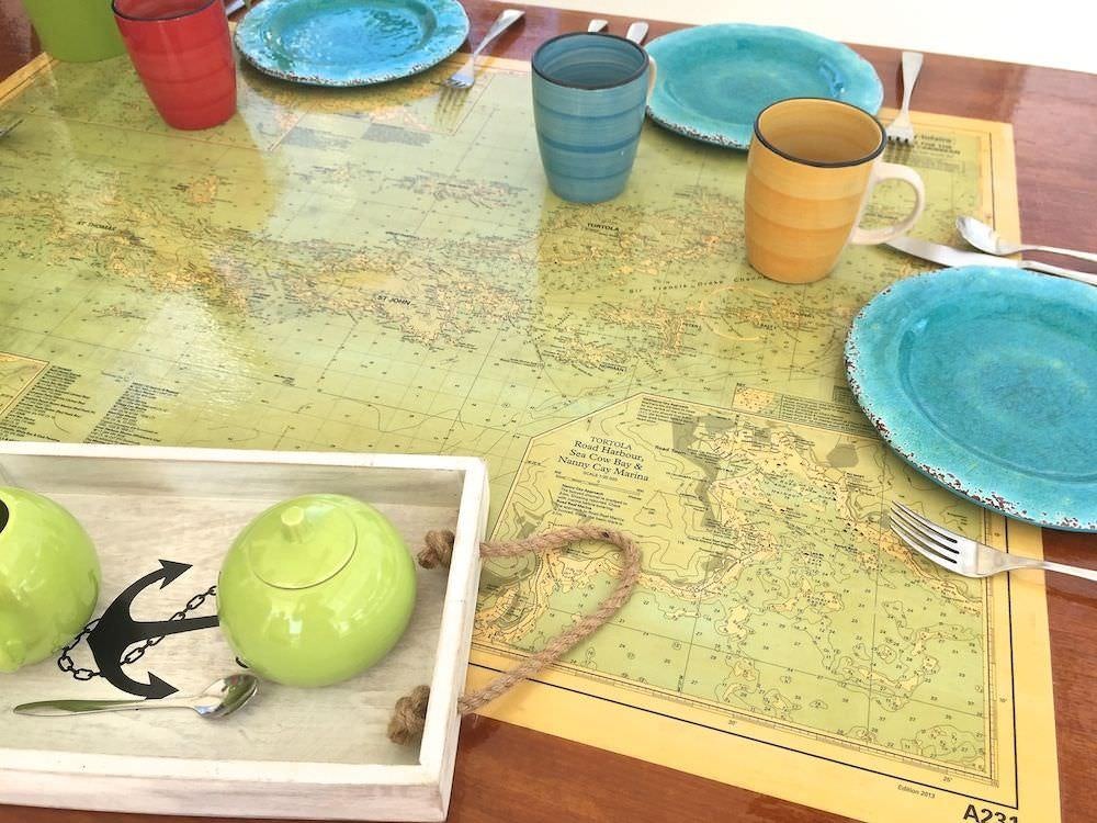 a table with plates and cups on it aboard MANGO Yacht for Charter