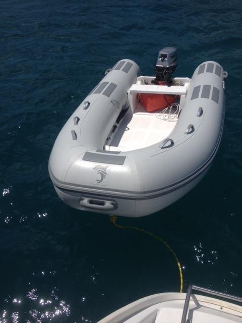 a white boat in the water aboard MANGO Yacht for Charter
