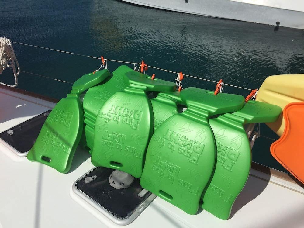 a row of green and black batteries aboard MANGO Yacht for Charter
