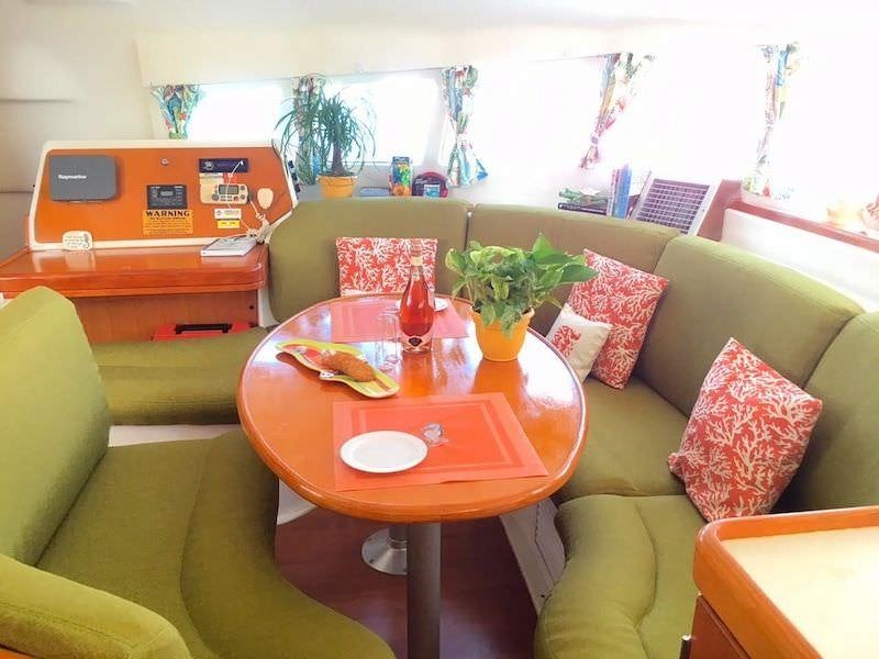 a living room with a couch and a table aboard MANGO Yacht for Charter