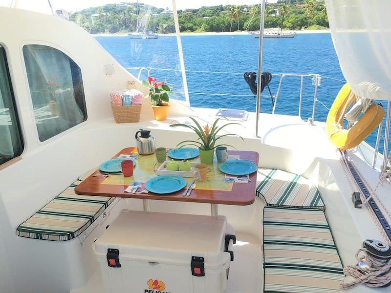 a table with a tray of food on it aboard MANGO Yacht for Charter