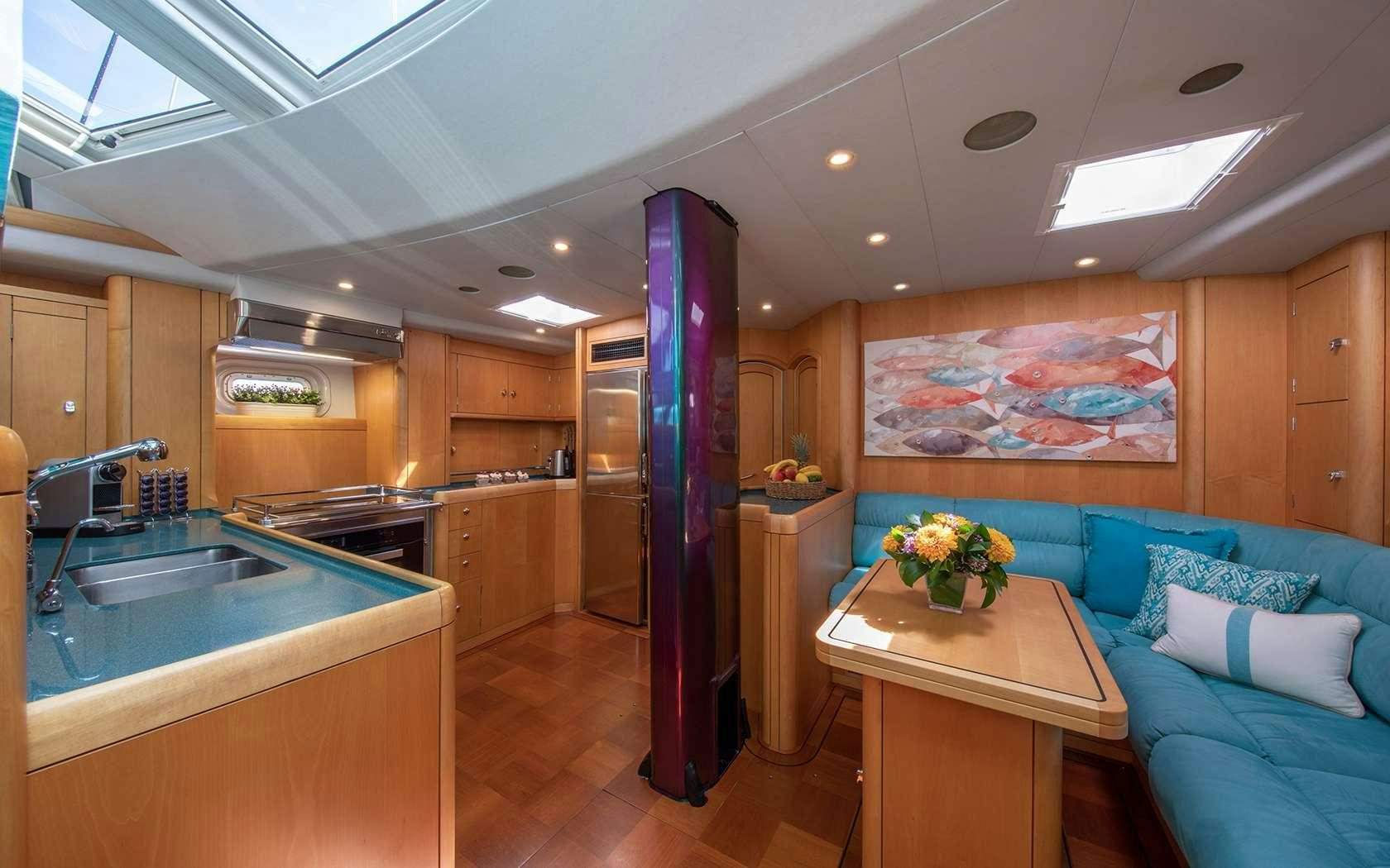 a kitchen and living room aboard BARE NECESSITIES Yacht for Charter