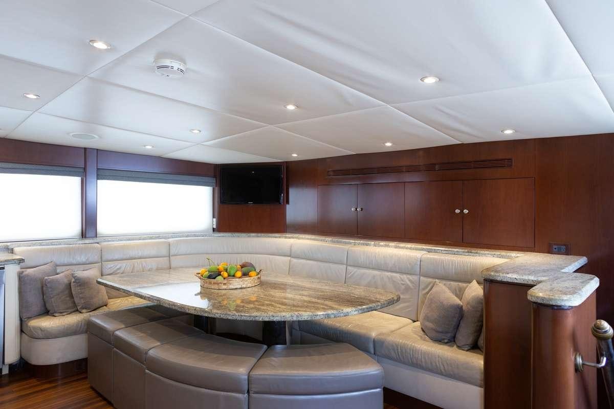 a room with a couch and a table aboard ODIN Yacht for Charter